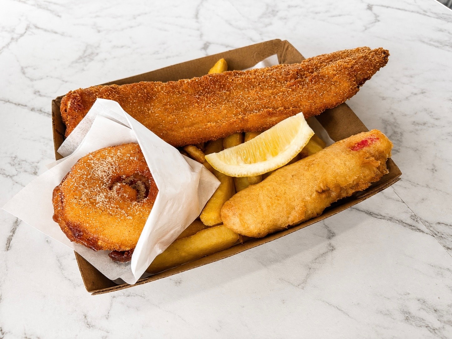 Fish and fritter pack in takeaway box