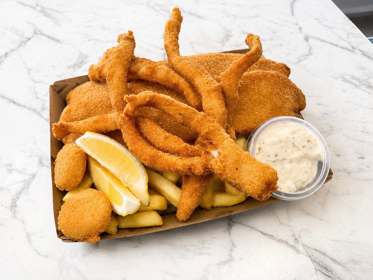 Fish, calamari and extras on a platter